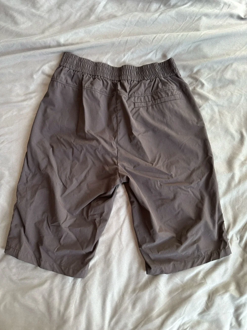 Black long nylon tech shorts, size M/L